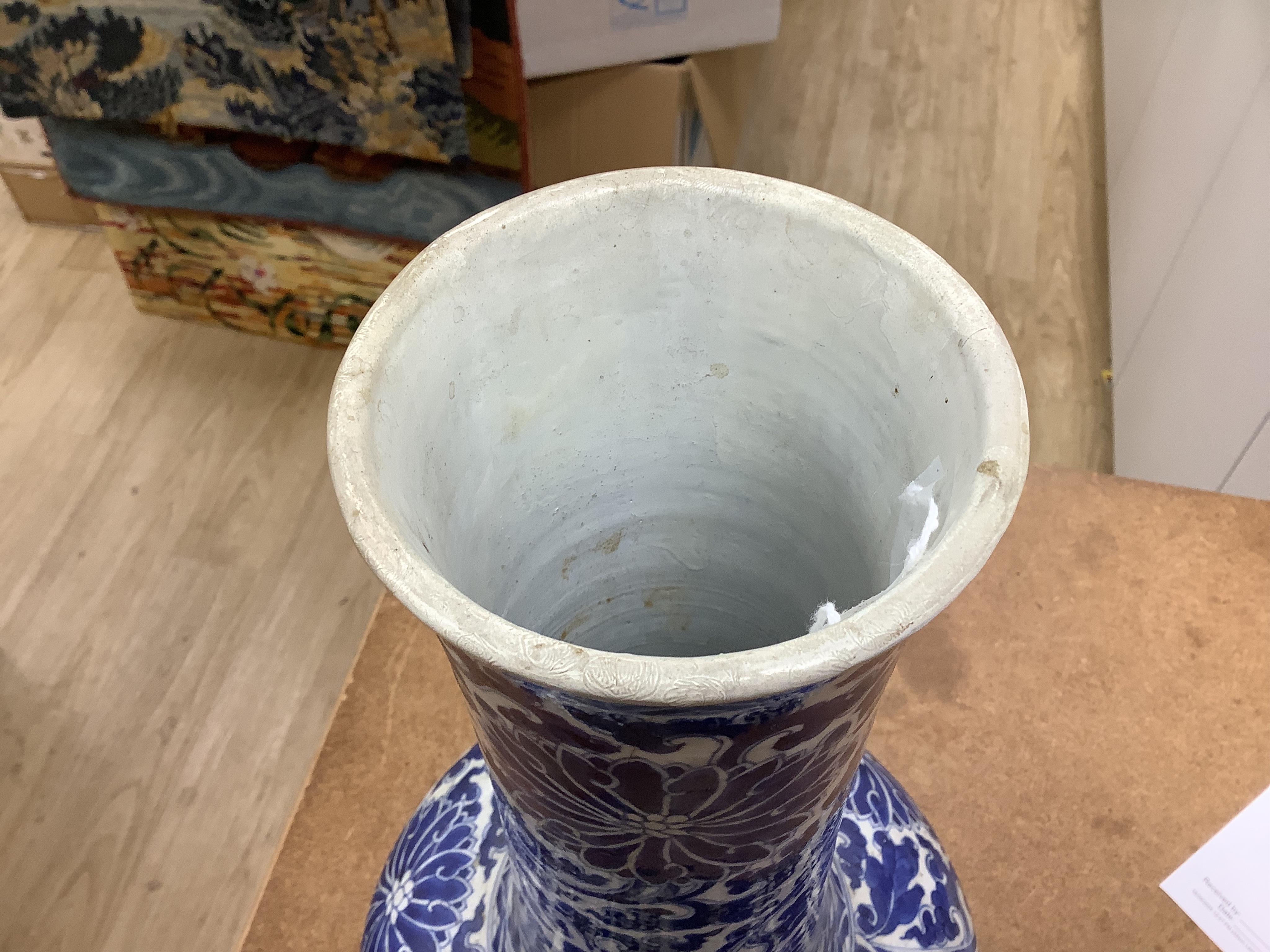 A Chinese blue and white bottle vase with lotus decoration, restored, Kangxi Period, 44cm high